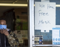 A man leaves the Eagle St. Express Market where they are giving away free masks on Saturday, April 25, 2020 in Utica, NY during the Covid-19 pandemic lockdown in New York State.  (Copyright © 2020 Nancy L. Ford Photography)